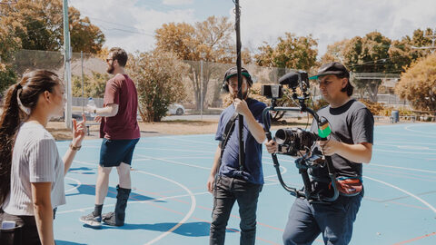 Portable's storytelling team on a live shoot on a school basketball court